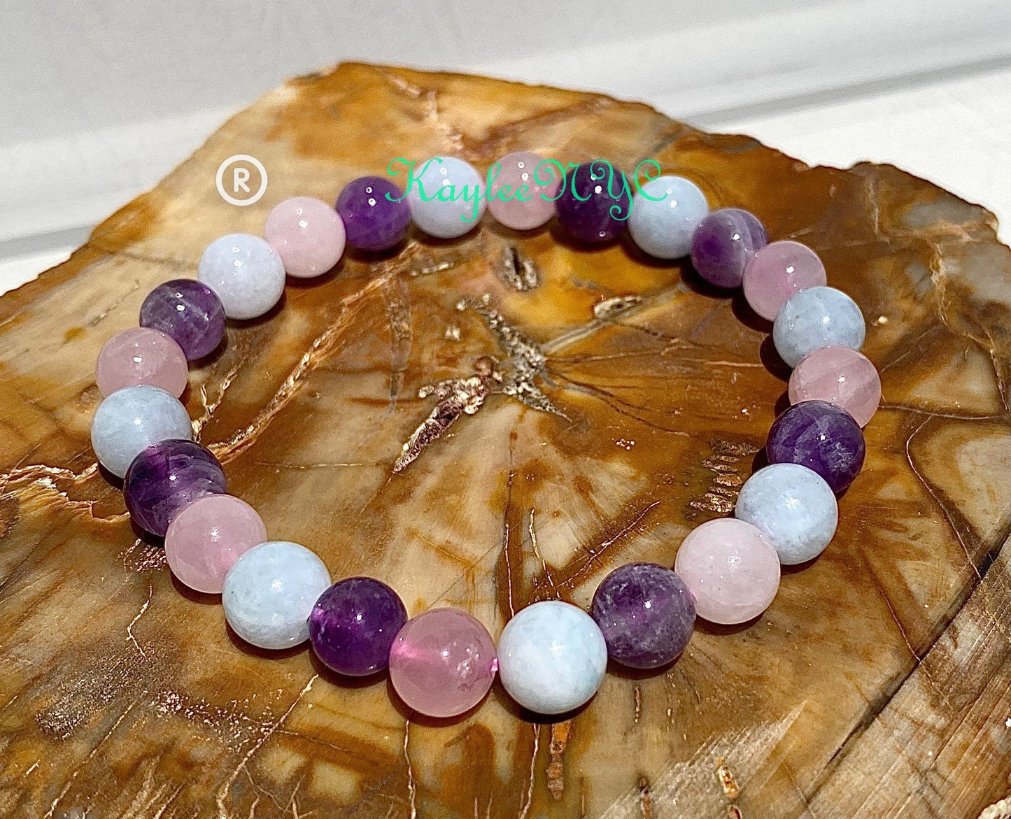 Wholesale 6 Pcs Natural Crystal Bracelet 8mm 7.5” Stretch Bracelet Crystal, Amethyst, Rose Quartz, and Aquamarine.