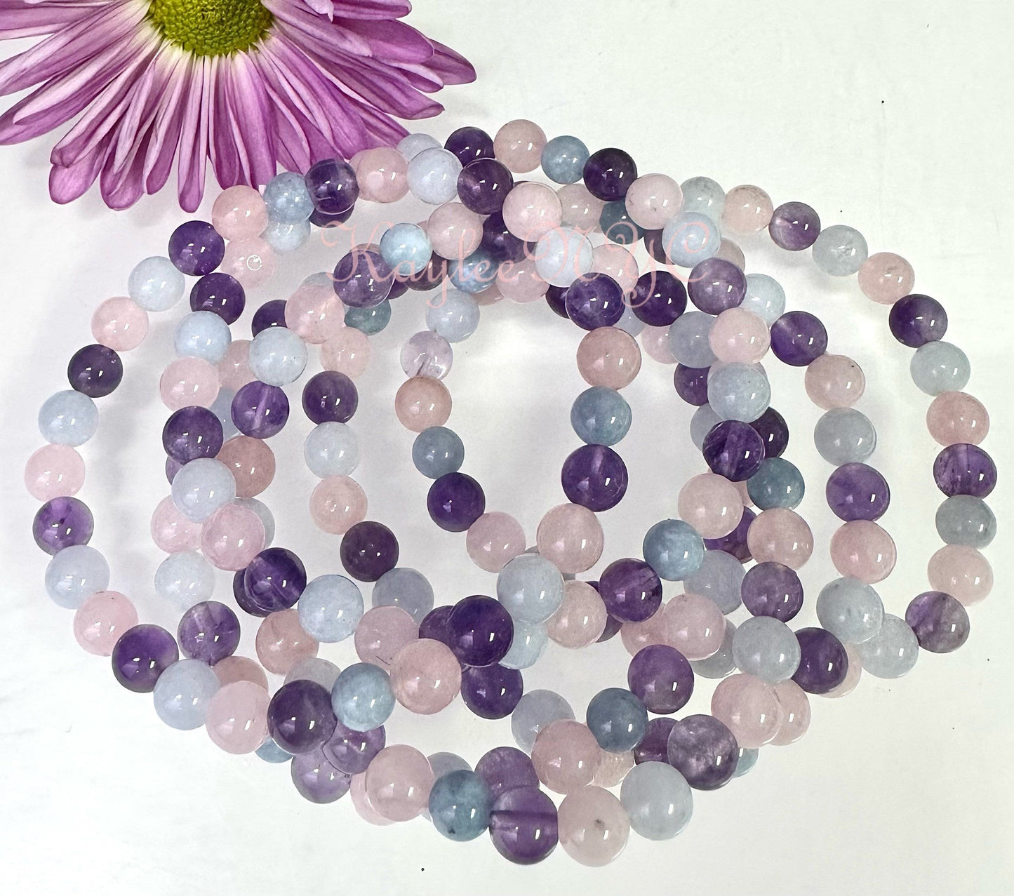 Wholesale 6 Pcs Natural Crystal Bracelet 6mm 7.5” Stretch Bracelet Crystal, Amethyst, Rose Quartz, and Aquamarine.